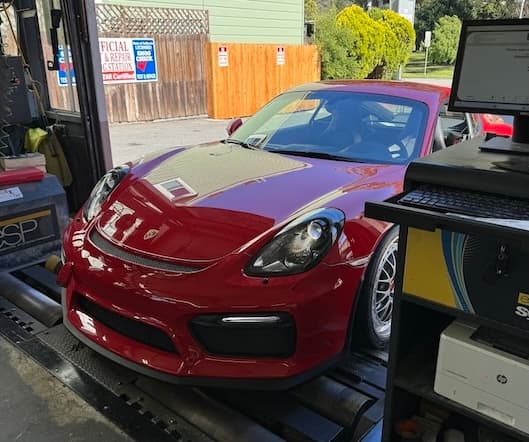 Red Porsche on the smog check dyno at Masonic Smog & Repair